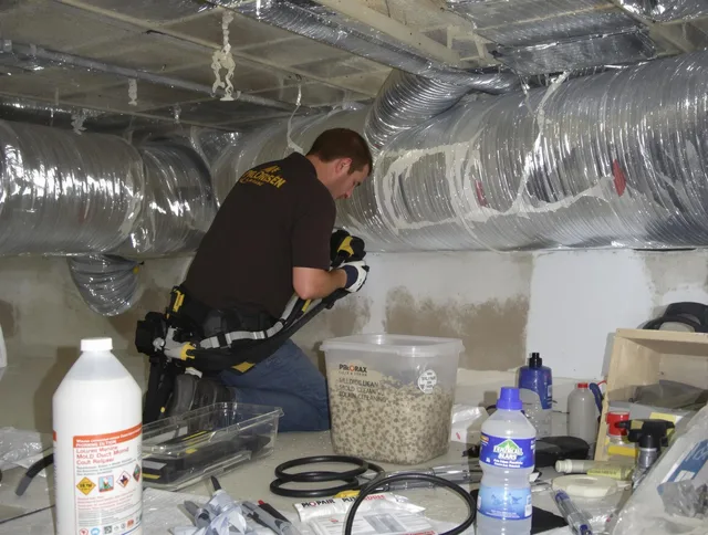 Rockland Air Duct Cleaning specialist performing professional mold removal from air ducts in Rockland