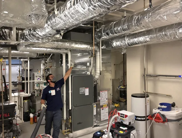 Rockland Air Duct Cleaning specialist performing thorough furnace duct cleaning in a Rockland residence