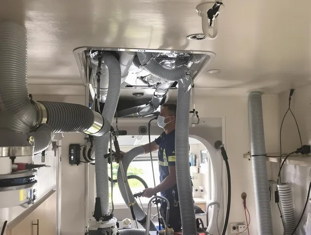 Rockland Air Duct Cleaning specialist performing precise mobile home duct cleaning in Rockland