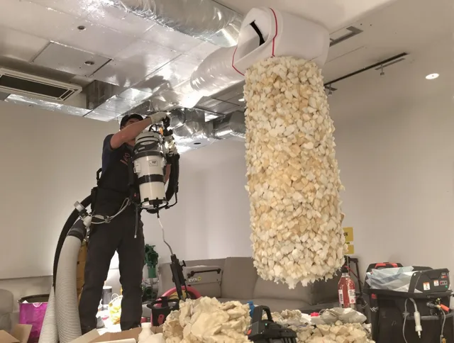 Rockland Air Duct Cleaning technician performing precision vacuum insulation removal in a residential property in Rockland