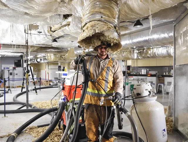Professional vacuum insulation removal by Rockland Air Duct Cleaning expert in Rockland